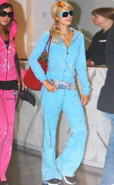 two women dressed in pink and blue at an airport