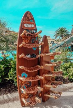 a wooden surfboard is sitting in the sand