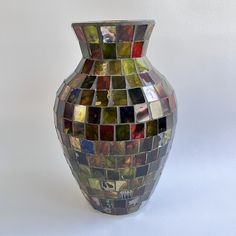 Add some color to your home décor with this beautiful Pier 1 stained glass mosaic vase. The intricate design features a rainbow of colors, including green, red, and blue, making it a perfect addition to any room in your home. Crafted from high-quality glass, this vase is sure to last for years and is a great way to display your favorite flowers or decorative items. With its unique design and eye-catching colors, this new old stock vase is perfect for those who want to add a touch of elegance to Stained Glass Mosaic Art, Mosaic Vase, Glass Mosaic Art, Blue Rainbow, Home Decor Vases, Stained Glass Mosaic, Favorite Flowers, Pier 1, Glass Mosaic