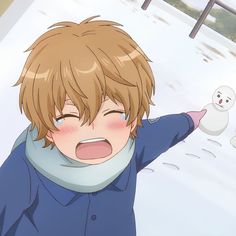 a young boy with his arms out in front of a snowman and another person behind him