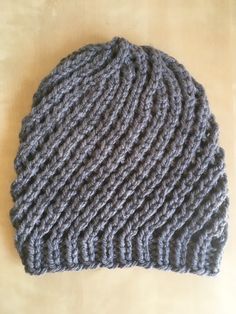 Diagonal lace slouch knit hat with bulky grey synthetic washable yarn, 11" long, 20" circumference stretches to 27" One Size Gray Knit Hat, Gray Knit Beanie One Size, Gray Knit Beanie Hat, Gray Crochet Hat One Size, Hand Knitted Gray Crochet Hat One Size, Gray Crochet Hat, One Size Fits Most, Adjustable Gray Crochet Hat, Gray One Size Yarn Beanie, Gray Hand Knitted Crochet Hat One Size