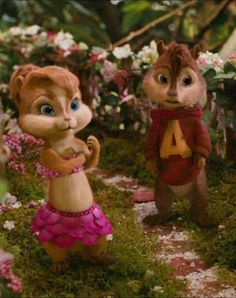 the chipmuns are standing in front of some flowers and trees with letters on them