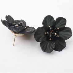 Wow the crowd with these magnificent FLOWER EARRINGS! These beautiful earrings will add a pop of color to your outfit and a dose of glamour to your style. Enjoy the compliments you’ll get when you wear these statement earrings—they’re sure to turn heads! Elegant Black Earrings For Spring, Black Flower Earrings For Gift, Black Jewelry For Spring Party, Elegant Black Flower Earrings For Party, Spring Gift: Black Jewelry, Black Flower Jewelry For Party, Chic Black Flower Jewelry, Trendy Black Flower-shaped Jewelry, Elegant Black Spring Jewelry