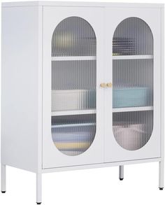 a white cabinet with two glass doors