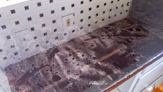 a kitchen counter that has been covered in dirt