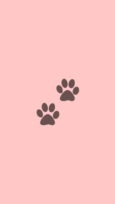 two dogs paw prints on a pink background, one is black and the other is brown