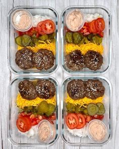 four plastic containers filled with different types of food