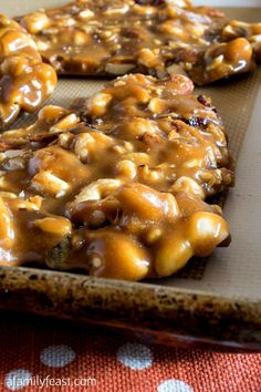 some cookies covered in caramel sauce and nuts