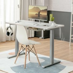 a desk with a computer on top of it in front of a chair and ladder