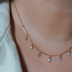 Synthetic opals and cubic zirconias (CZs) fixed on a dainty gold filled chain Available in an adjustable lengths 14kt gold filled chain, with synthetic opal pendants Pendants are each 4-3mm round Necklace Charms, Mother Of Pearl Necklace, Synthetic Opal, Layered Chains, Cz Pendant, Beaded Anklets, Chain Anklet, Opal Pendants, Opal Necklace