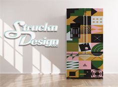 a colorful refrigerator sitting in the middle of a room next to a wall that says, struch design