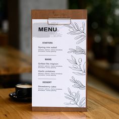 a menu sitting on top of a wooden table