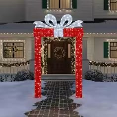 a house decorated with christmas lights and presents