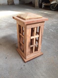 a wooden table sitting on top of a cement floor