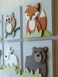 four different animal magnets mounted to the side of a wall