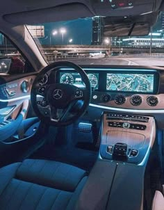 the interior of a mercedes benz s - class car at night with its dashboard illuminated