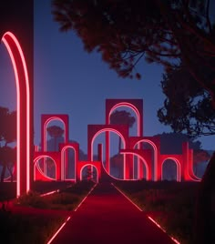 an illuminated pathway leads to several arches and archways in the night time, with red lights on them