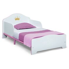 a white and pink bed with a crown on it