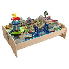 a child's wooden toy train set with cars and buildings on it, including a bridge