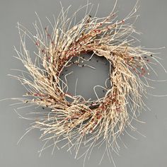 a dried wreath on a gray background