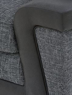 close up view of the back of a gray and black chair