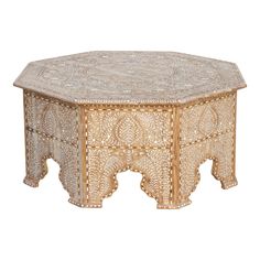 an intricately carved wooden table on white background