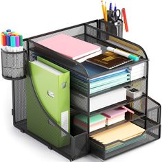 a desk organizer with pens, notebooks and other office supplies in it on a white background