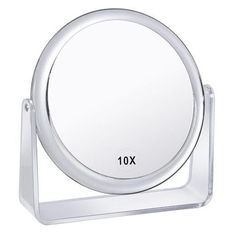 a round mirror on a stand with the word 10x in black ink and white background