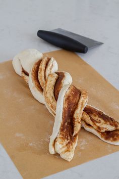 sliced bananas on top of brown paper next to a knife