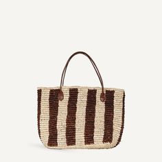 A woven raffia shoulder bag with an organic stripe print. Wear it as a small beach tote, or day or evening bag. Features two smooth leather shoulder straps and an interior leather bottom panel to keep the bag's structure. Sunset Drinks, Woven Raffia, Travel Collection, Travel Wallets, Day Bag, Beach Tote, Small Accessories, Leather Interior, Stripe Print