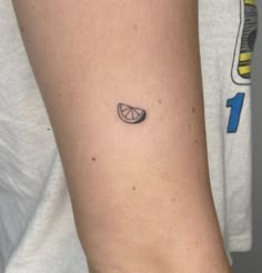 a person with a small tattoo on their arm