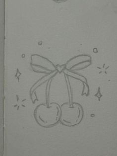 a drawing of two cherries with a bow on it's head is shown