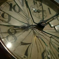 a close up of a clock face with numbers on the face and hour marks painted on it