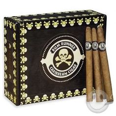 three cigars in a black box with skulls on the front and one is open