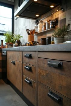 a kitchen with wooden cabinets and metal handles