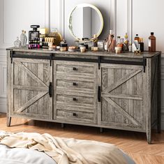 a wooden dresser with mirrors and bottles on it