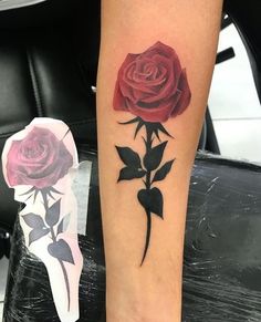 a rose tattoo on the left leg