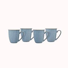 three blue coffee cups sitting next to each other