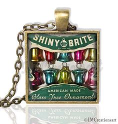 shiny brite glass christmas ornaments are in a box on a chain with the words shiny brite