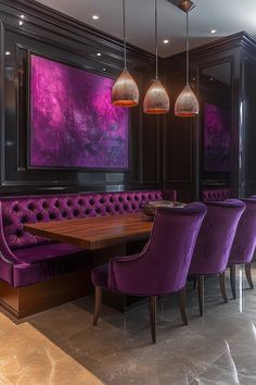 a dining room with purple chairs and a large painting hanging on the wall above it