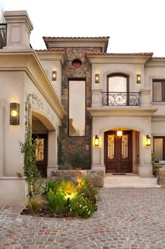 a large house with stone steps leading to the front door