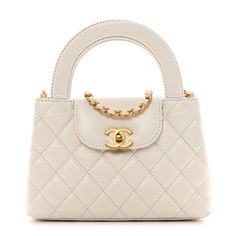 This is an authentic CHANEL Shiny Aged Calfskin Quilted Nano Kelly Shopper in White. This chic mini bag is crafted of quilted calfskin leather in white. The bag features rolled top handles, a gold chain leather threaded shoulder strap, and a crossover strap with a gold CC turn lock. This opens to a white leather interior with zipper and patch pockets. White Chanel Bag, Chanel Mini Bag, Chanel Crossbody, Oversized Bag, Kelly Bag, Versace Bags, White Purses, Leather Thread, Wallet Fashion