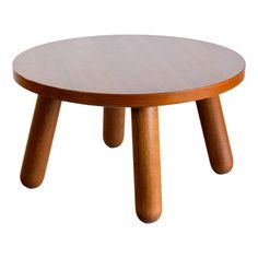 a wooden table with three legs and a round shape on the top, against a white background