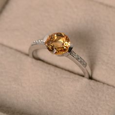 Citrine Topaz Promise Ring, Classic Yellow Citrine Birthstone Ring, Fine Jewelry Sapphire Ring With Citrine Accent Stones, Citrine Center Stone Topaz Ring, Classic Citrine Rings With Accent Stones, Orange Round Jewelry With Brilliant Cut, Fine Jewelry Citrine Topaz Ring With Accent Stones, Classic Yellow Sapphire Jewelry Promise Ring, White Gold Citrine Birthstone Ring With Gemstone