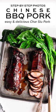 an image of bbq pork on a tray with green beans and spinach leaves