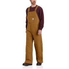 Built to take on the elements, these men's bib overalls are water-repellent, wind-resistant, and insulated. Made from Carhartt's strongest cotton duck with a double layer at the knees and reinforced kick panels. Built with ankle-to-thigh zips and all the pockets you could want. 12-ounce, firm-hand, 100% ring-spun cotton duck Nylon lining quilted to midweight polyester insulation Adjustable front-elastic suspenders Multi-compartment bib pocket with zipper closure Zipper Fly Two large lower-front Carhartt Bibs, Coveralls Mens, Work Overalls, Western Boots For Men, Mens Overalls, Safety Clothing, Men Carhartt, Work Boots Men, Bib Overalls