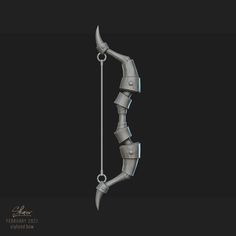 a metal bow and arrow on a black background