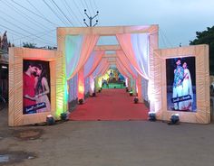 an archway decorated with pictures and lights