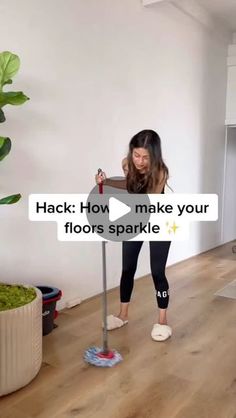 a woman is using a mop to clean the floor in her living room with text that reads, hack how make your floors sparkle