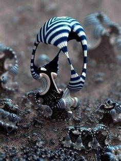 a ring with blue and white stripes on it surrounded by small black objects in the dirt